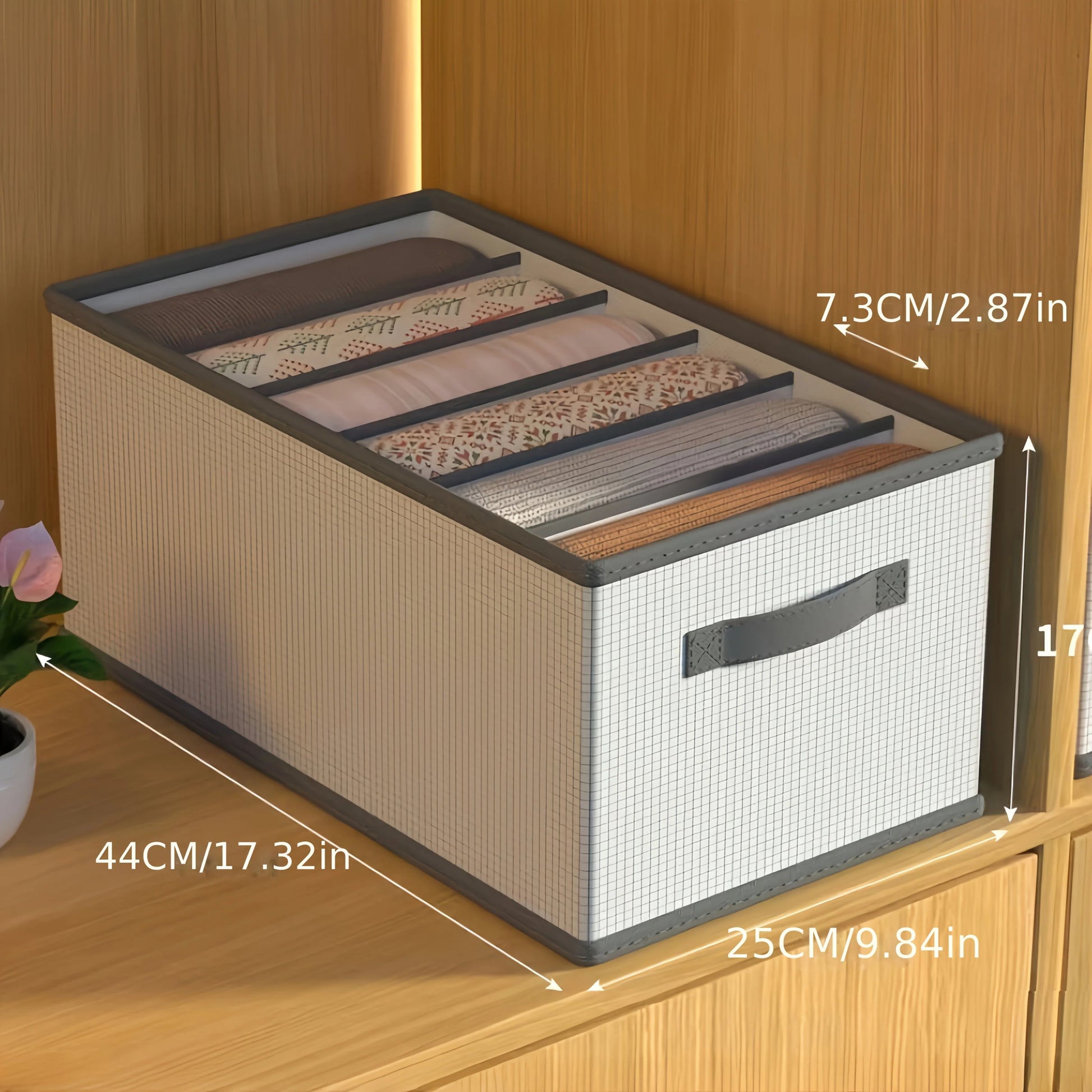 Storage box with fabric lid on a wooden surface, showing dimensions.