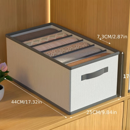 Storage box with fabric lid on a wooden surface, showing dimensions.