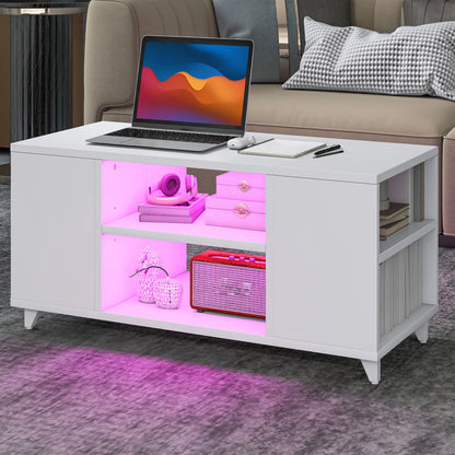 White coffee table with pink LED lighting displaying a laptop and decorative items in a living room setting.