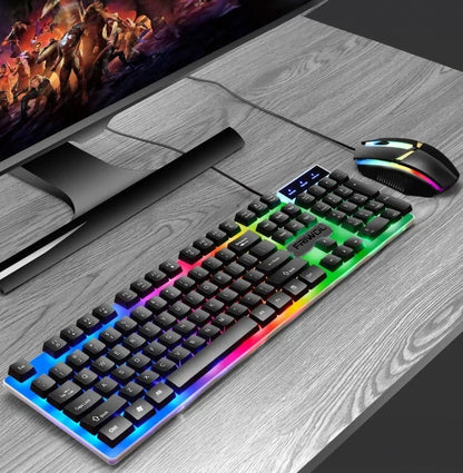 Gaming setup with keyboard, mouse, and monitor on a wooden desk