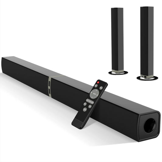 Black soundbar with remote control and two speakers on a white background
