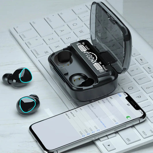 Wireless earbuds with charging case on a keyboard with smartphone displaying pairing screen.