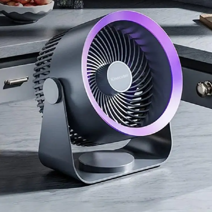Portable fan with purple accents on a wooden surface