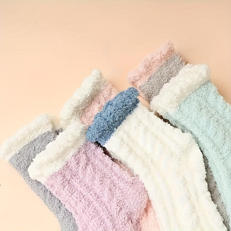 Set of colorful textured socks on a beige background