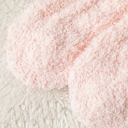 Close-up of pink textured yarn on a white background