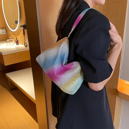 Person holding a colorful beaded bag in a bathroom setting