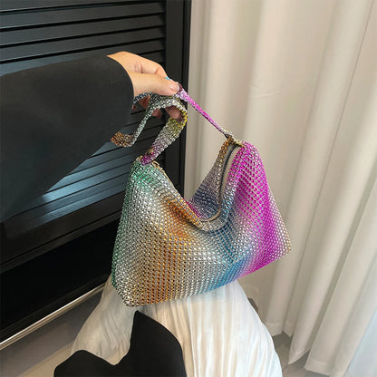 Multicolored mesh handbag held by a person with a neutral background