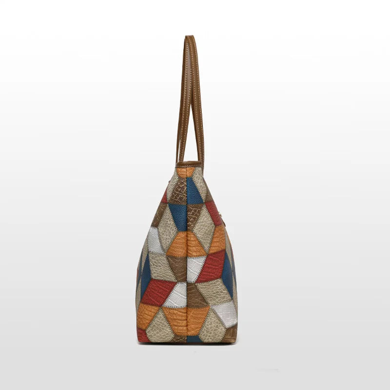 Multicolored geometric patterned handbag with brown handle on a white background