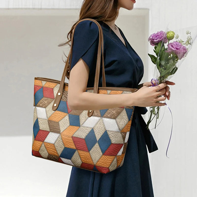 Woman holding a geometric-patterned handbag and flowers against a neutral background