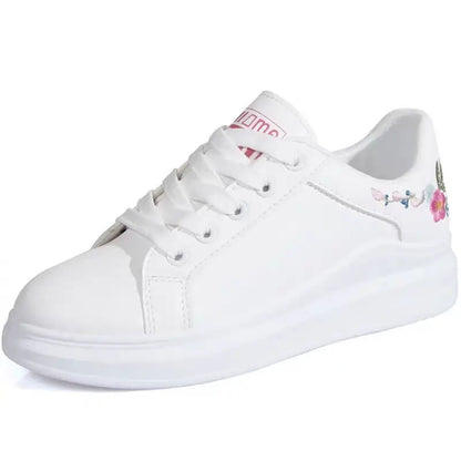 White sneaker with floral design on a white background
